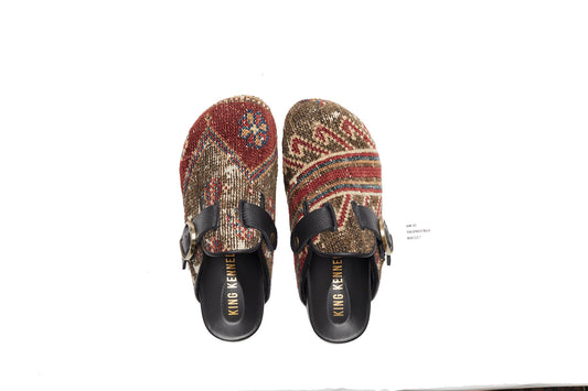 King Kennedy Rug Mules are one-of-a-kind and made of 100 year old antique Persian rug fragments with soft lambskin footbed and rubber sole. This pair is made of an antique Persian rug with a taupe, tan base with red and cream patterns. Made in Los Angeles.